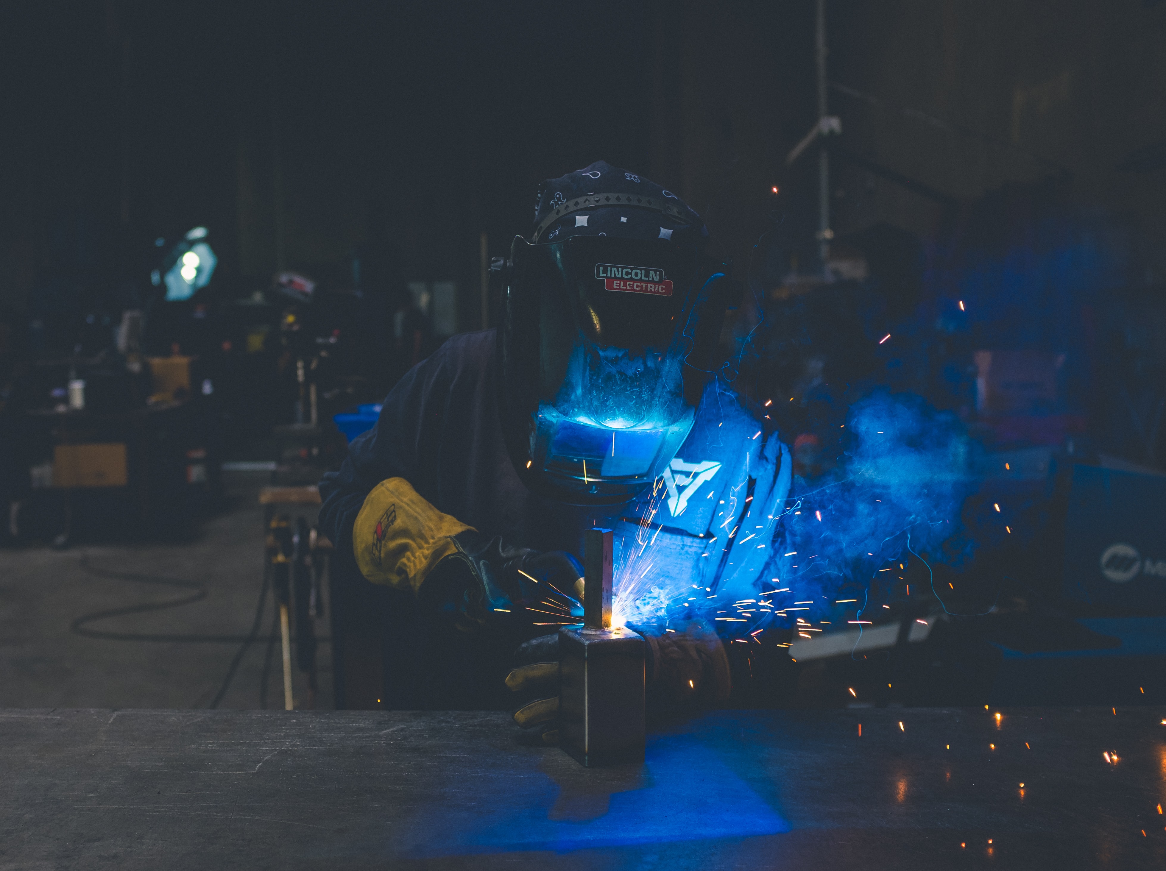 Welder working in an industrial facility